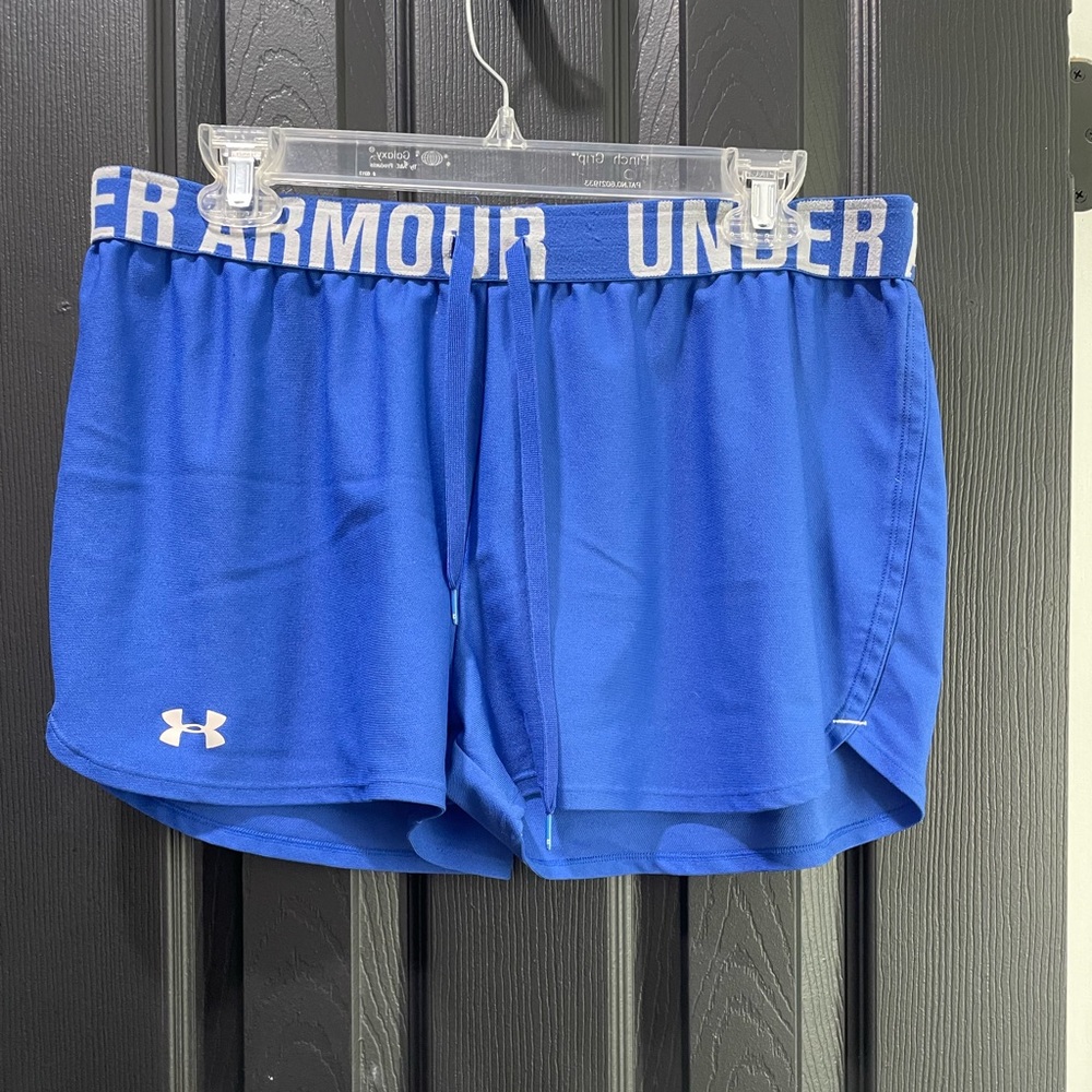 Under Armour women’s large heat gear shorts in royal blue.